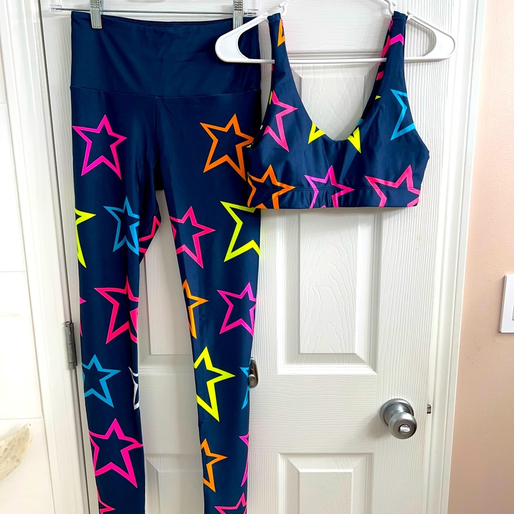 GoldSheep leggings and sports bra.black with blue and pink stars. Medium
